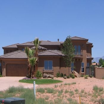 Two story home in southern utah with tiled roofing installed by stout roofing.