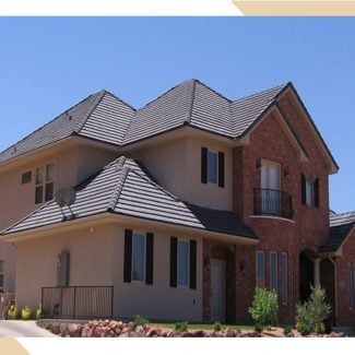 Two story home with tiled roof installed by stout roofing.