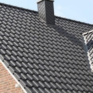 Brand new asphalt shingle roof installed on a residential home in Utah by Stout Roofing, showing clean lines and updated materials